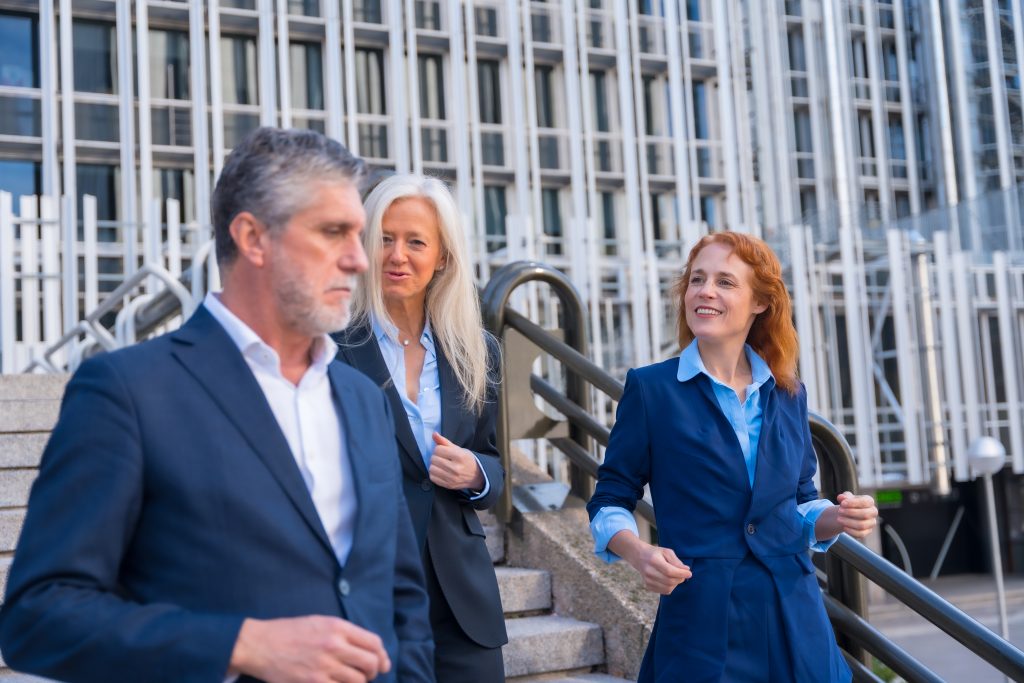 Three solicitors discussing a pre-nup agreement