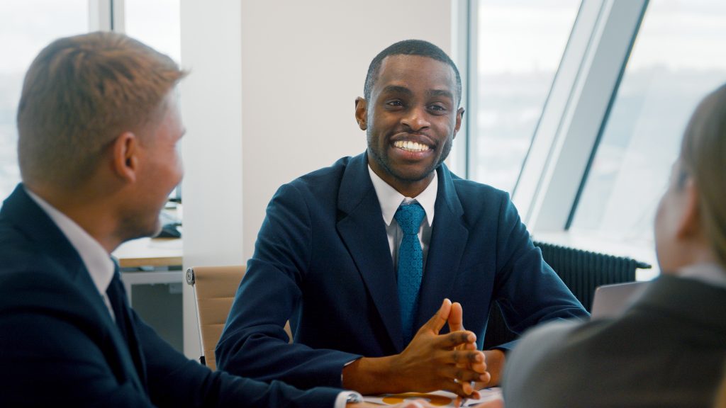 A group of legal advisors having a discussion in a meeting room